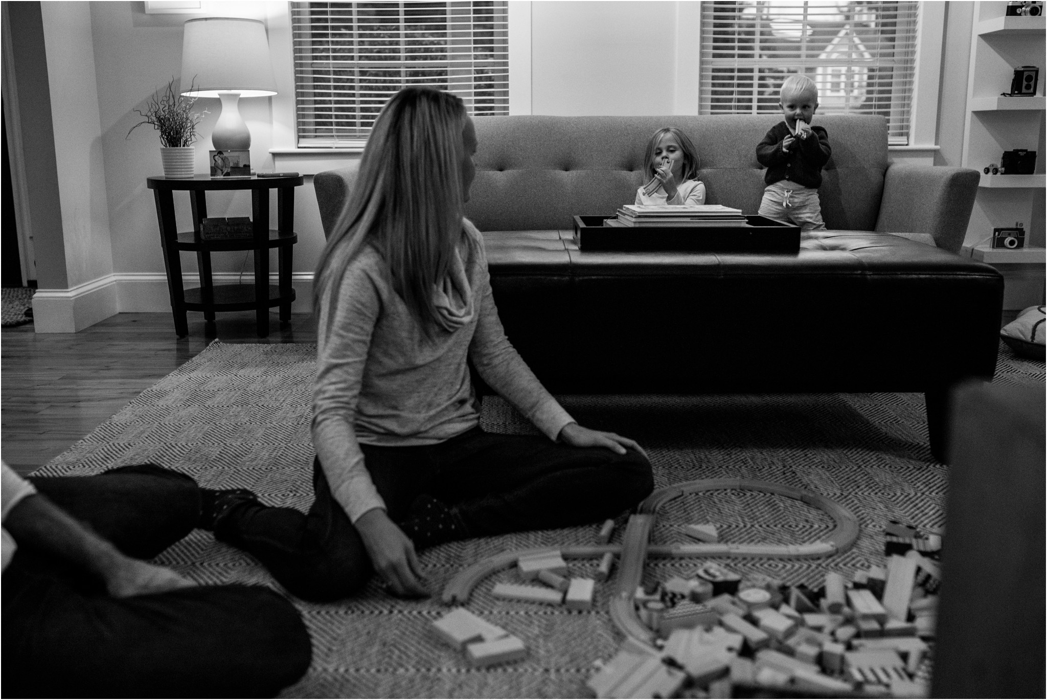 family playing blocks on the ground