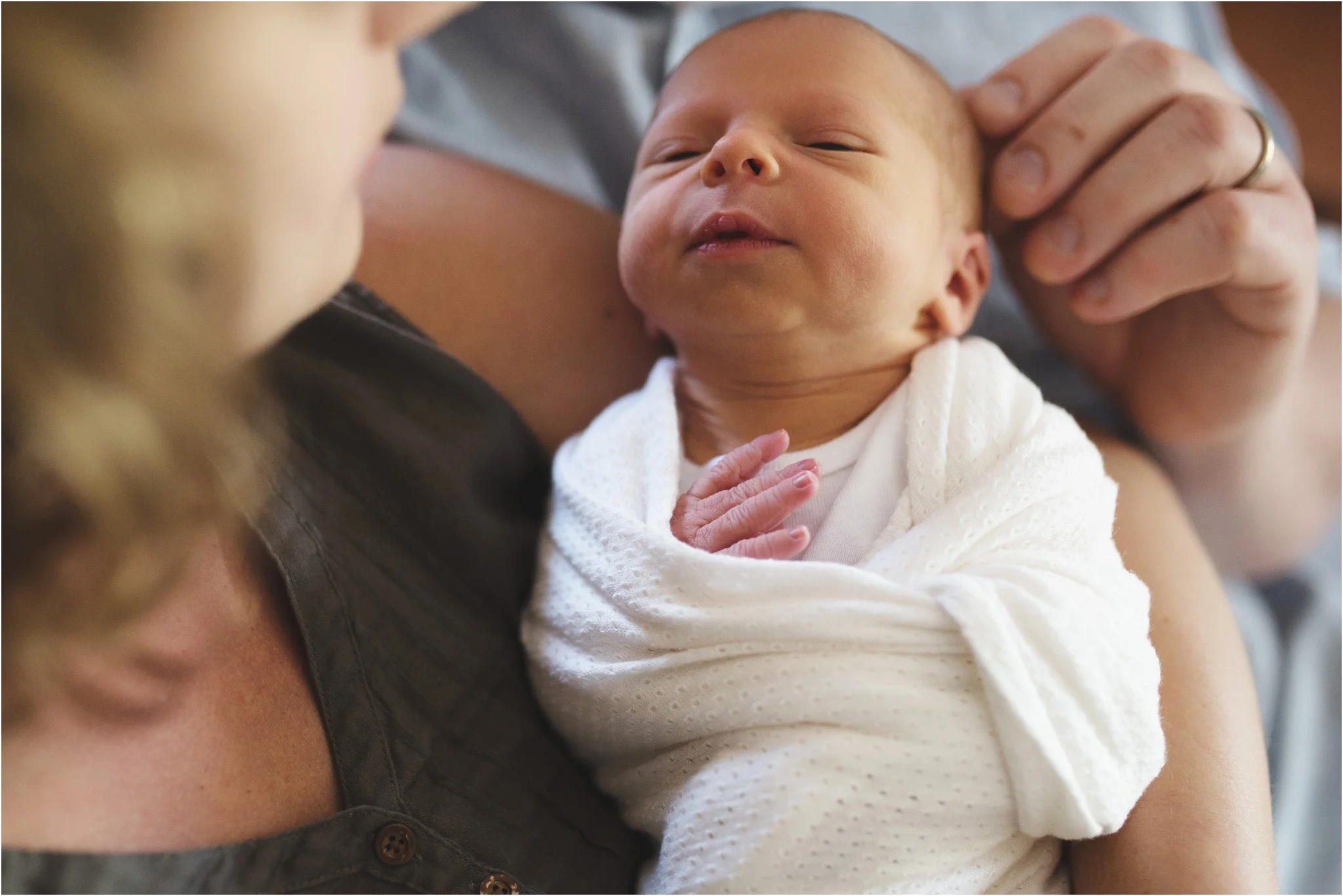 mom touching baby's head
