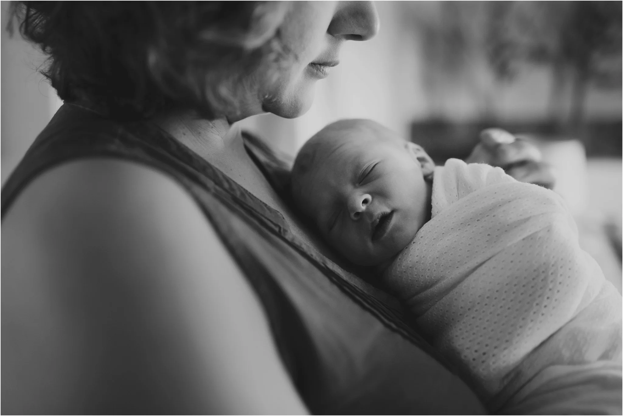 baby laying on mom's chest