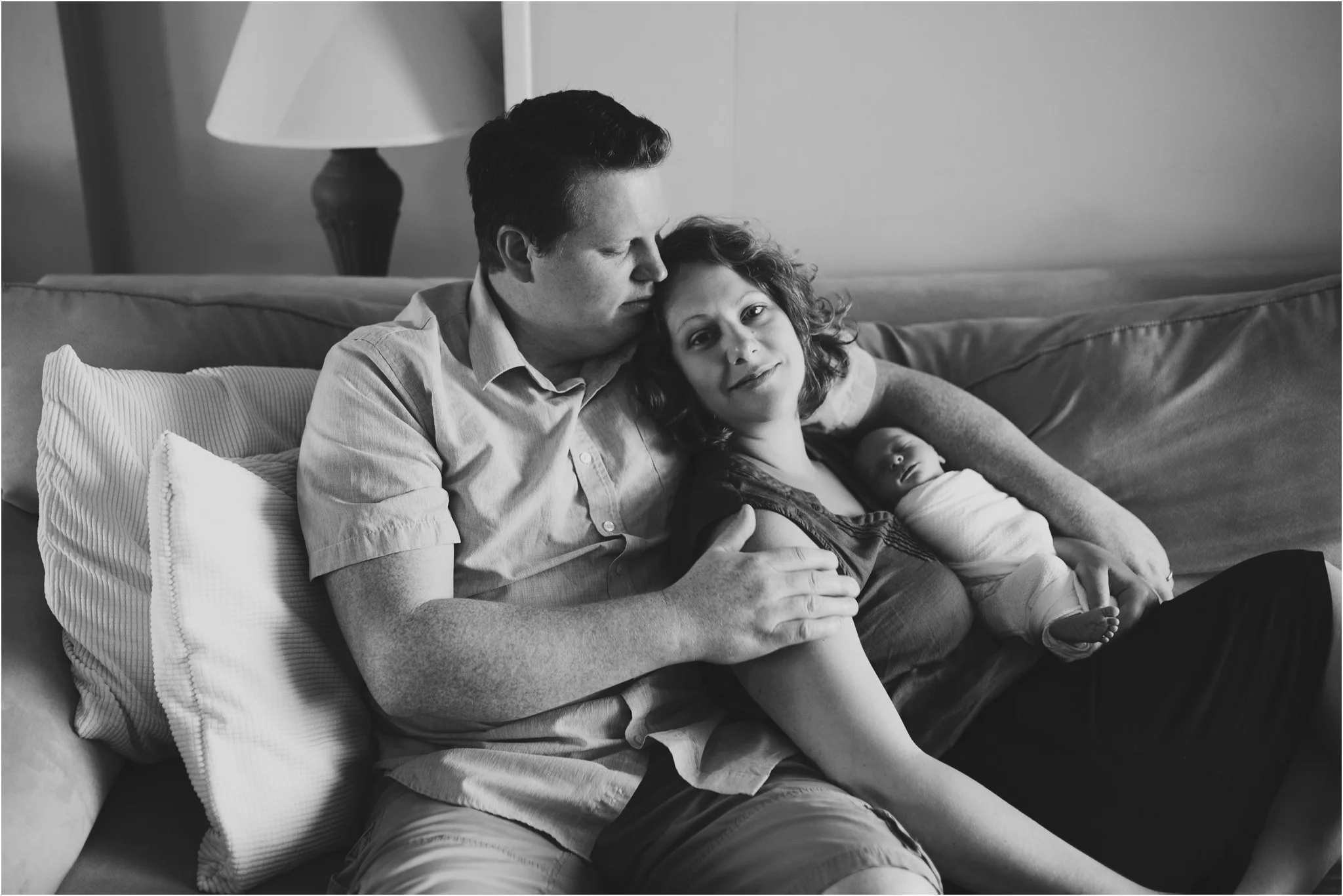 mom and dad sitting on the couch