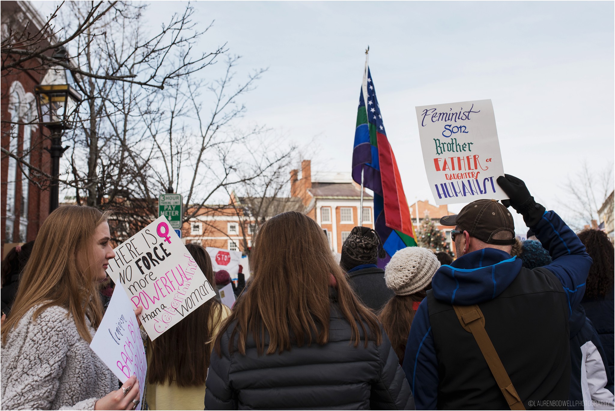 people gathered with signs