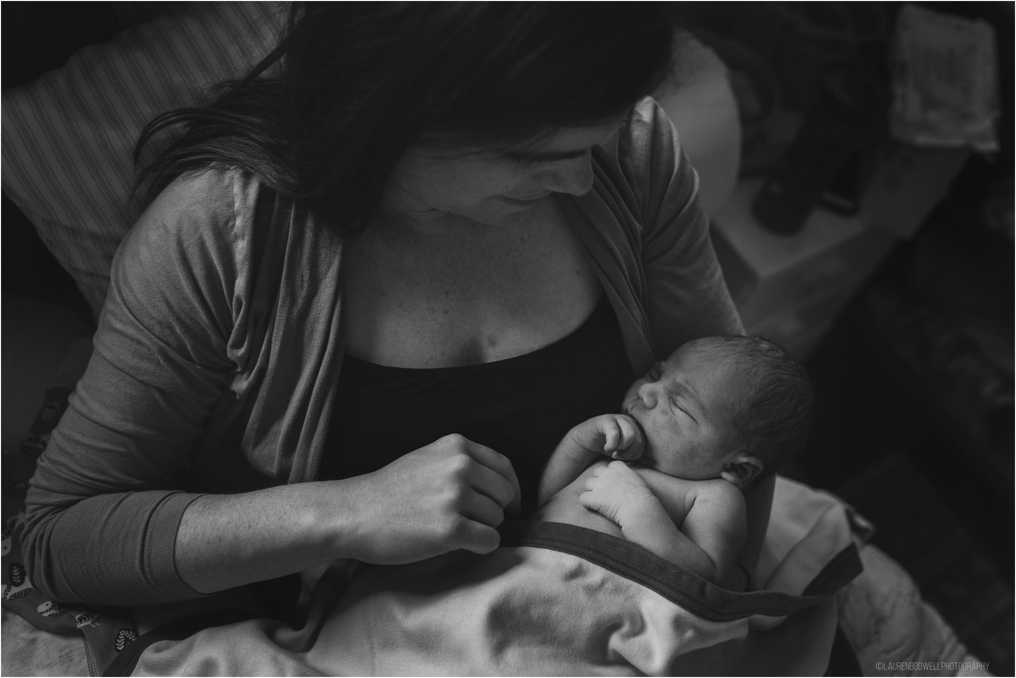 Mom holding new baby in her arms