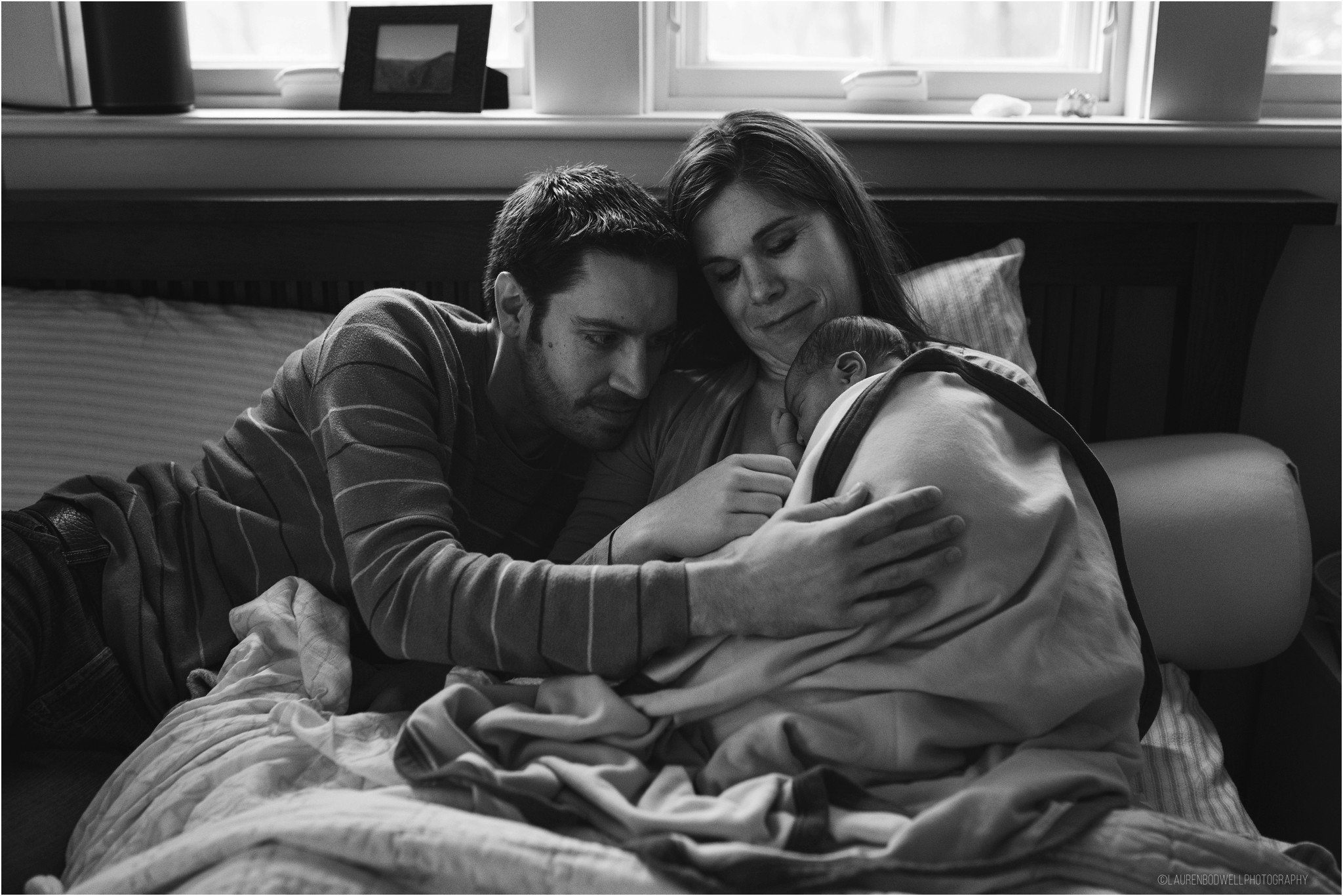 Mom and dad looking at baby