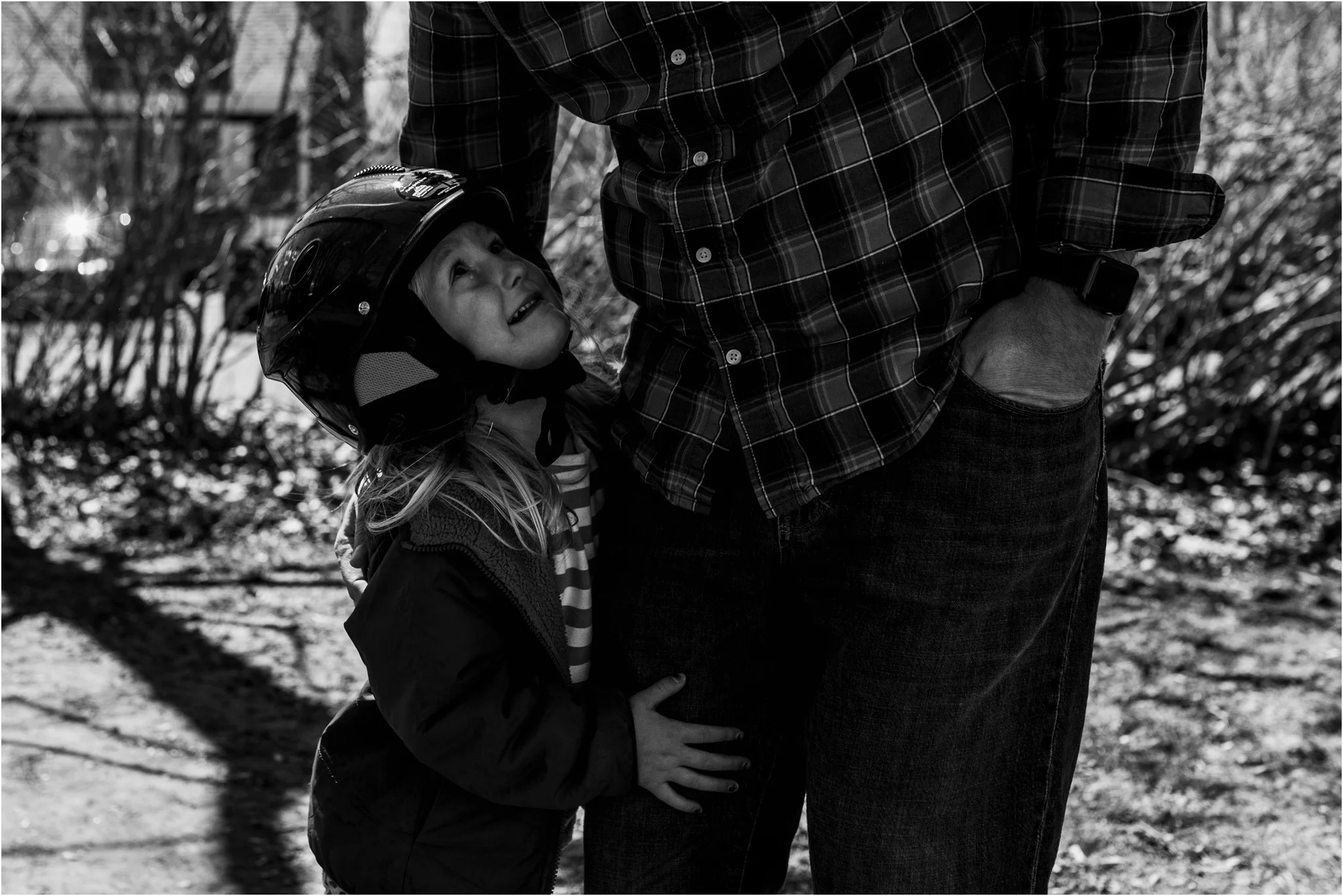 girl crying holding on to her dad