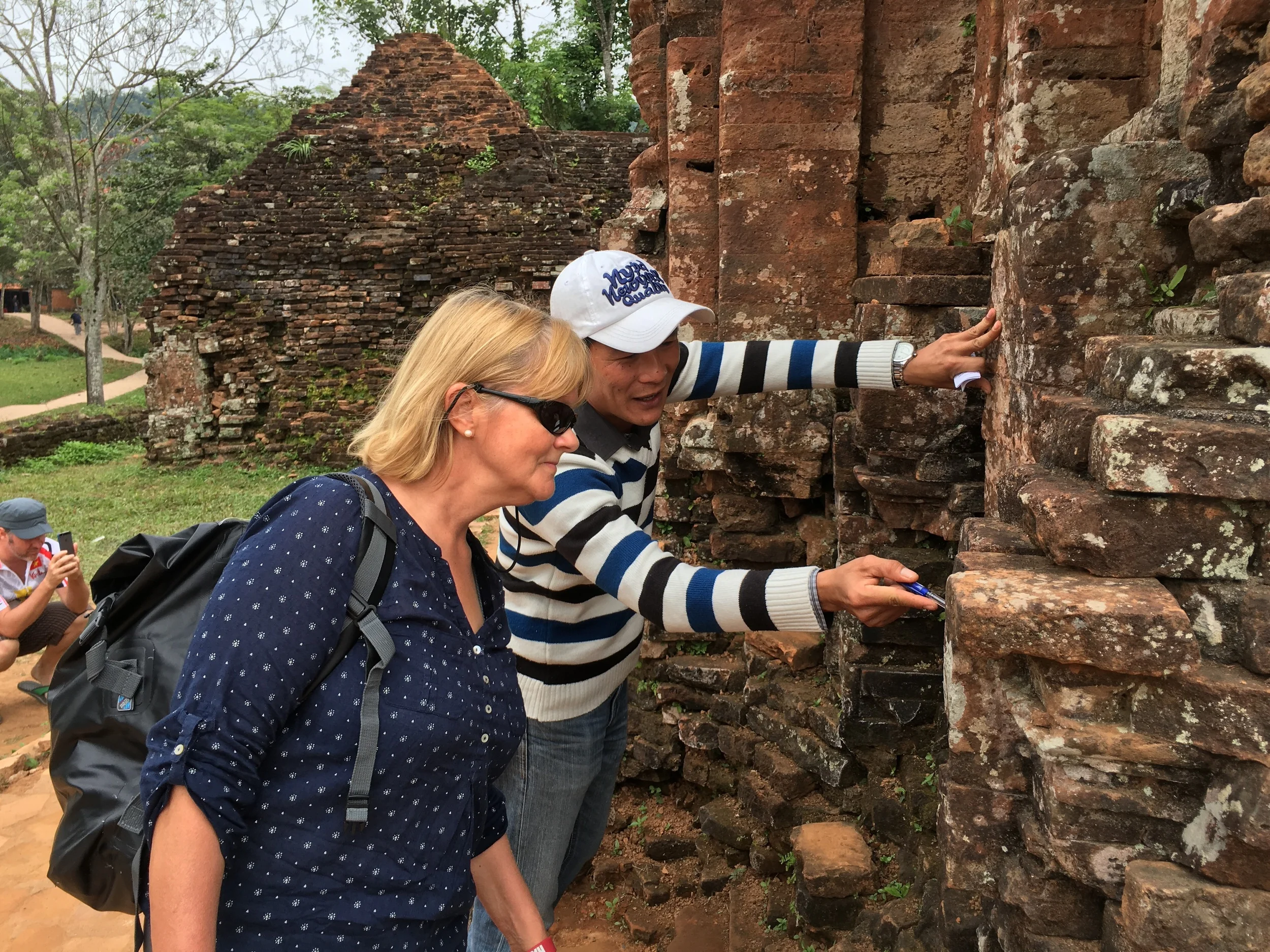 Quan points out the mystery of the absence of mortar in this 1000 year old archeological wonder.