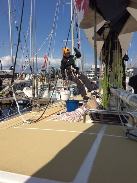 Linda goes up the mast for rigging work