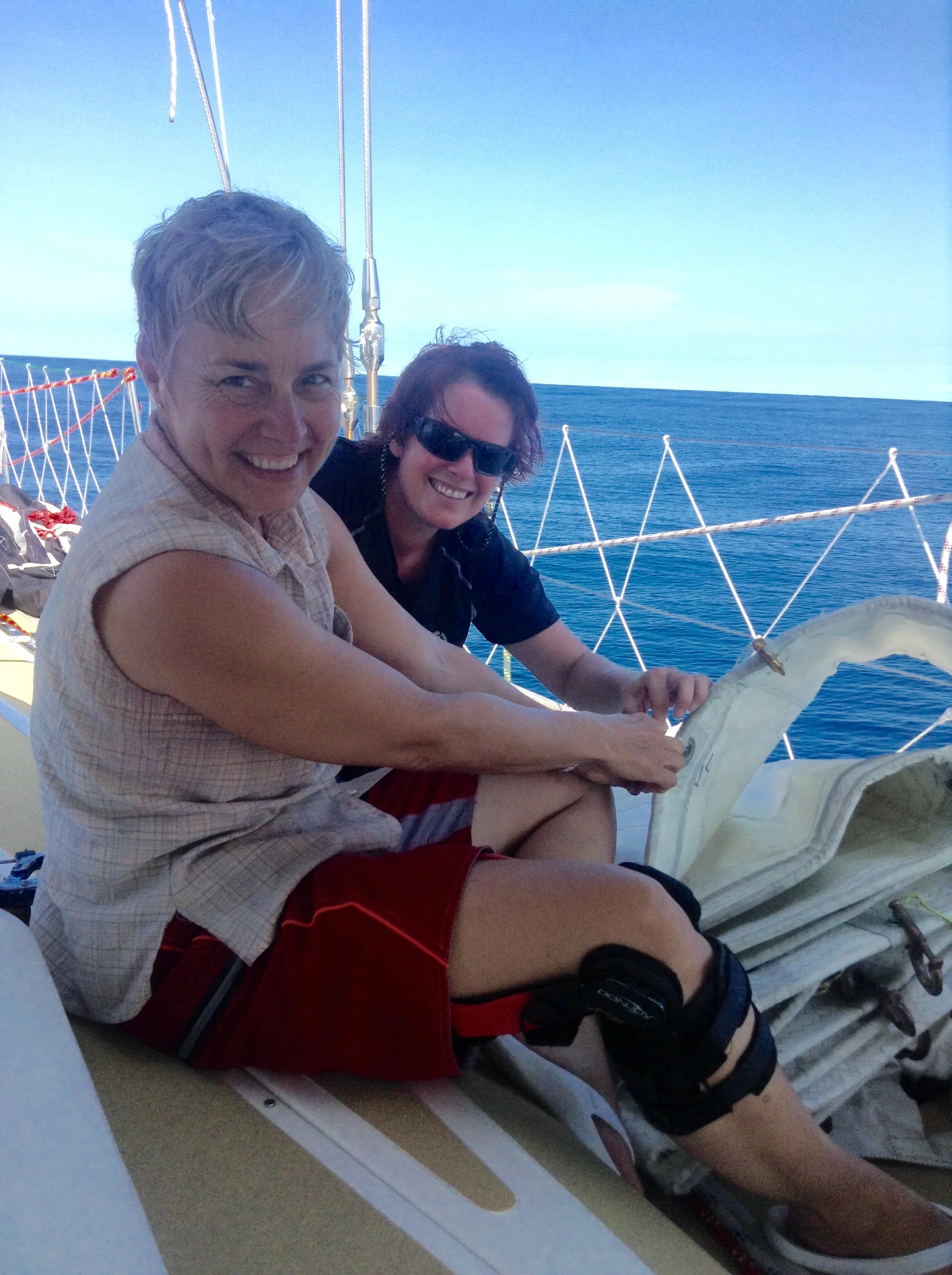 Lynn and Jenn service the hanks on the headsails