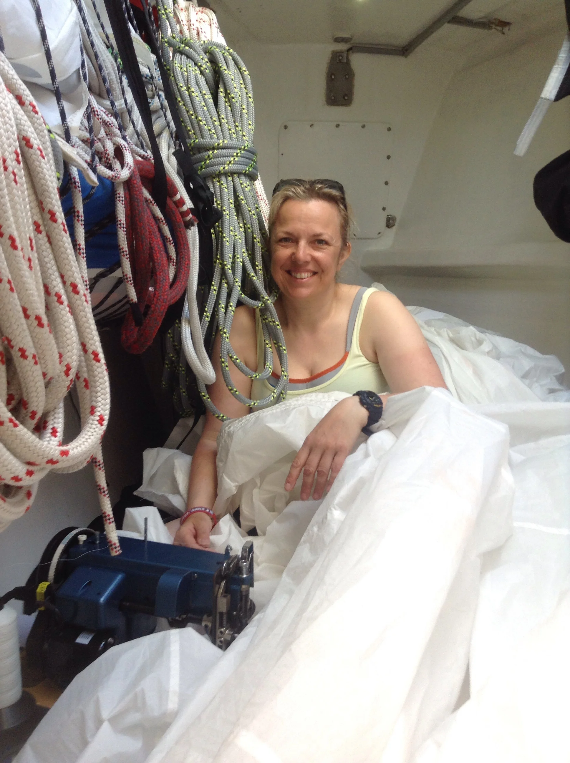 Next day... Jane in the sail locker cum sail loft with industrial portable sewing machine.