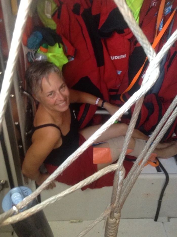 Post knee injury with make-shift brace. Sitting in the foulies locker near the companionway entrance down below hoping for a bit of breeze. Whew! So00000 hot!!