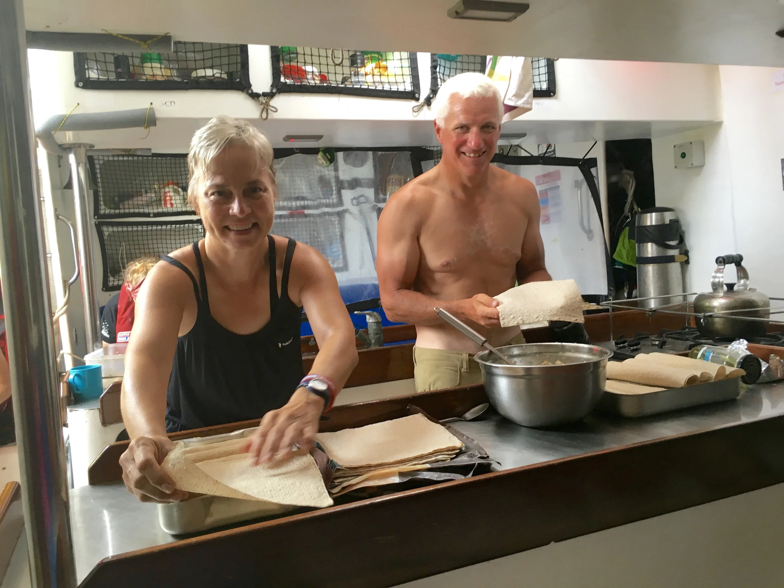 Ryan and I making wraps, as near to naked as we dare in the 40+C degree heat - Do we really have to bake bread? No oven on, please!!! 