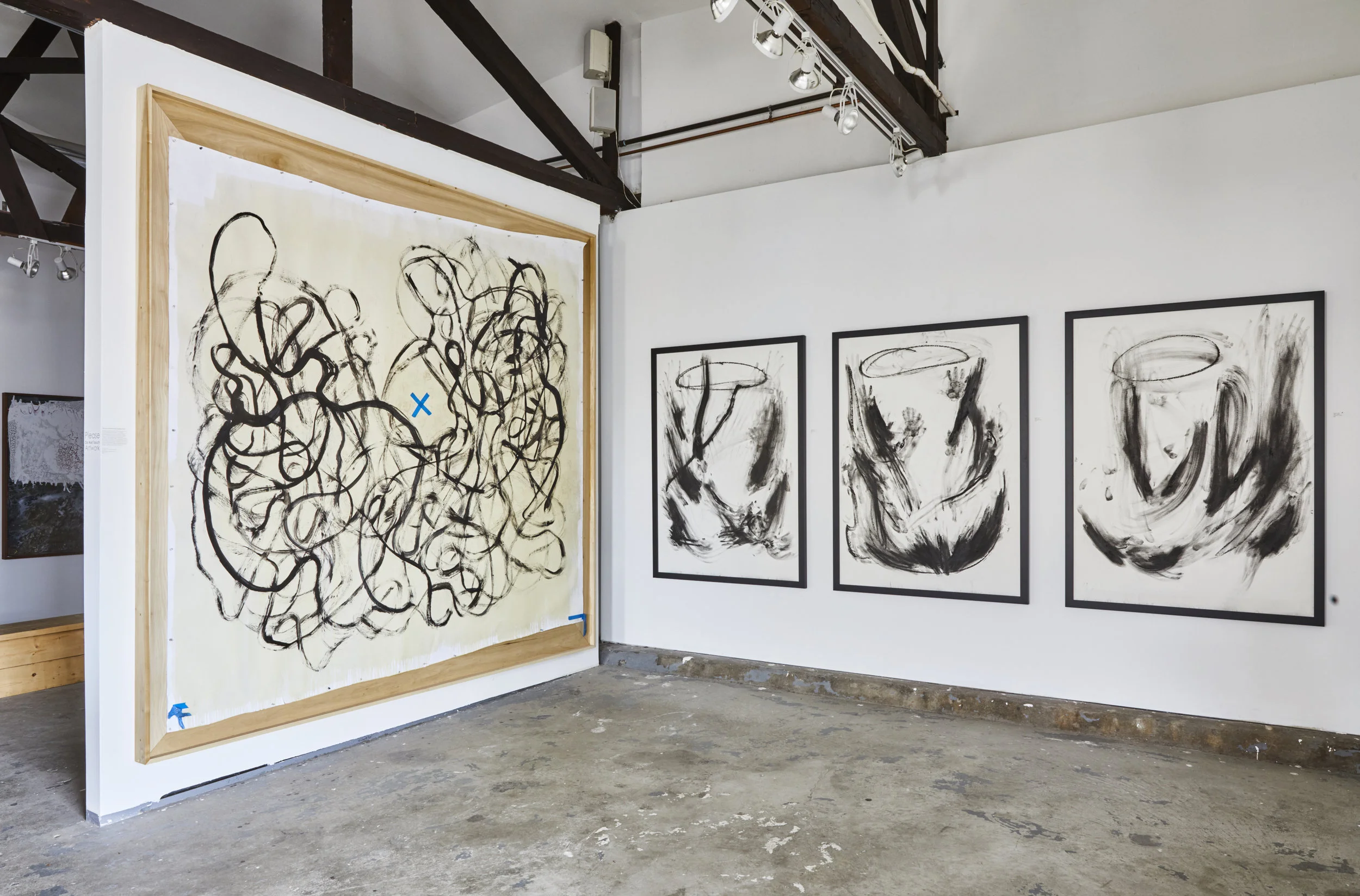 Left: "All the Love We Generate: Parallel Universe," 2017 India ink, acrylic, footprints, tape, polyurethane on paper 109" h x 115" w