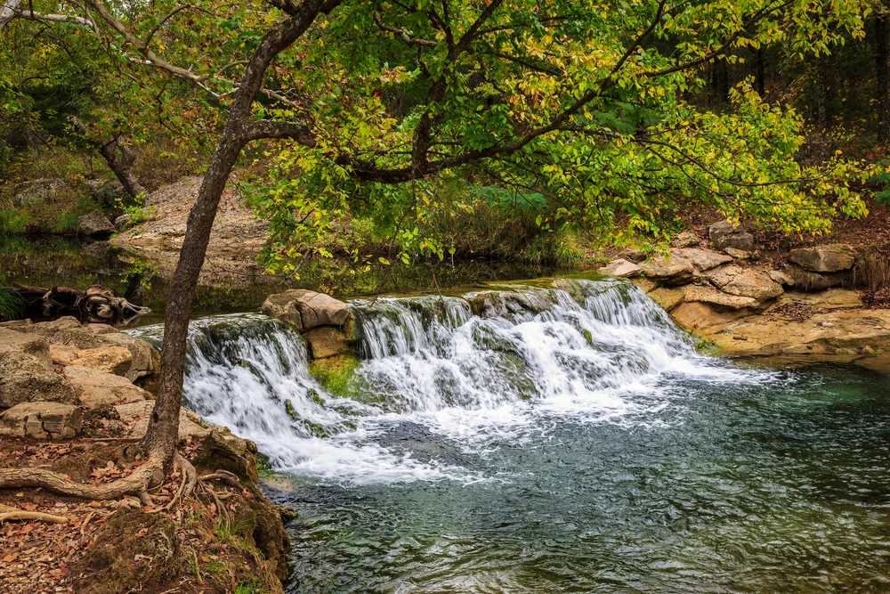 An Oklahoma Oasis Springs, streams, lakes-whatever it's form, water is the attraction at Chickasaw National Recreation Area. Little Niagra, and Rock Creek beckons waders and swimmers. Relax in the coolness of shaded stream or take a dip in a swimming hole. Veterans Lake calls anglers to test their skills. Lake of the Arbuckles provides excellent motorboating, skiing, fishing and swimming. For more information about visiting Chickasaw National Recreational Area, follow the link- http://www.nps.gov/chic/index.htm
