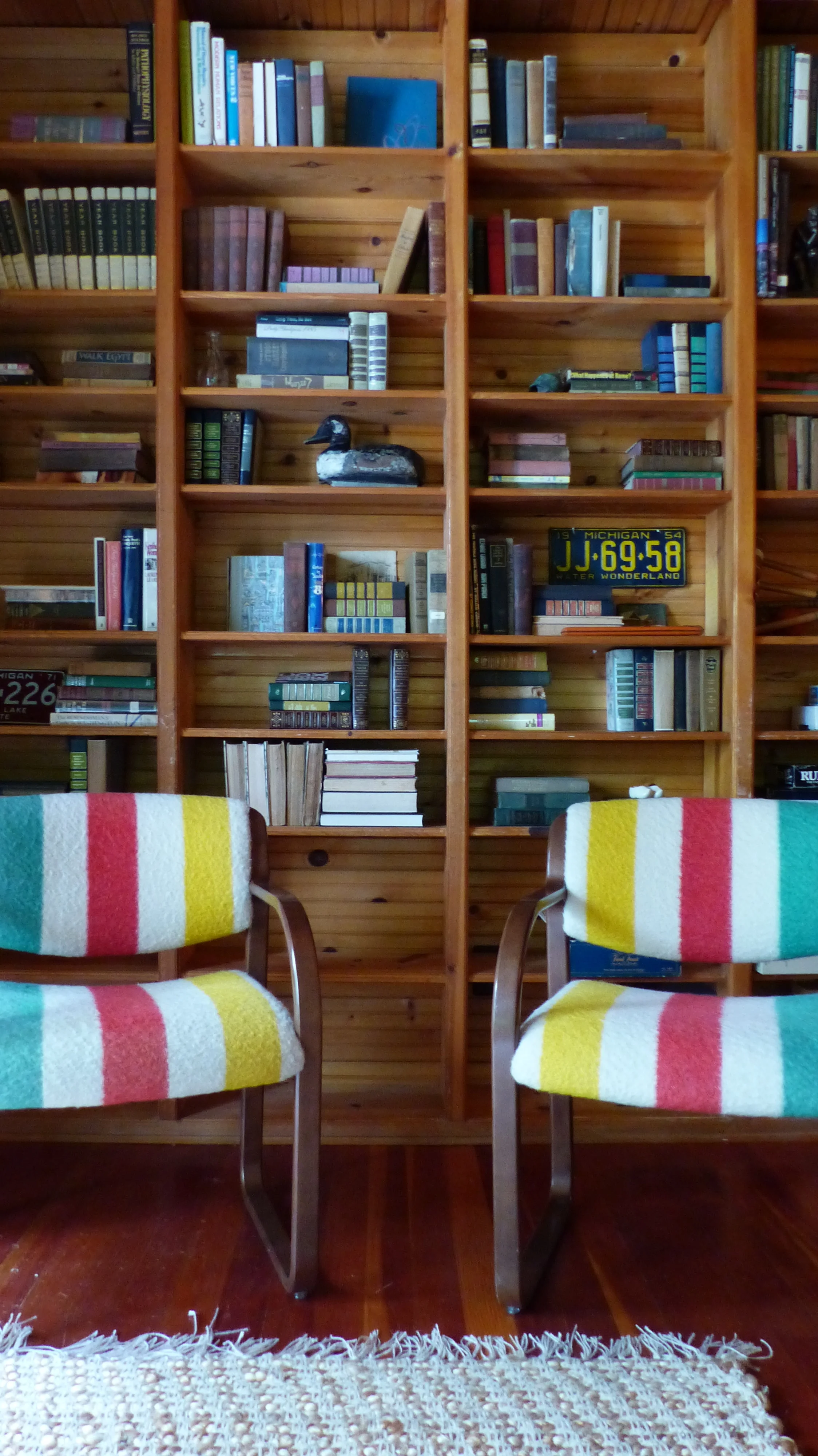 Styled bookshelves for miles! Hudson Bay chairs we found at Brimfield Chicago.