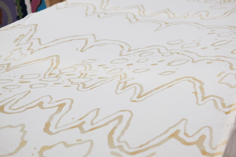 Wax applied to the fabric before dye