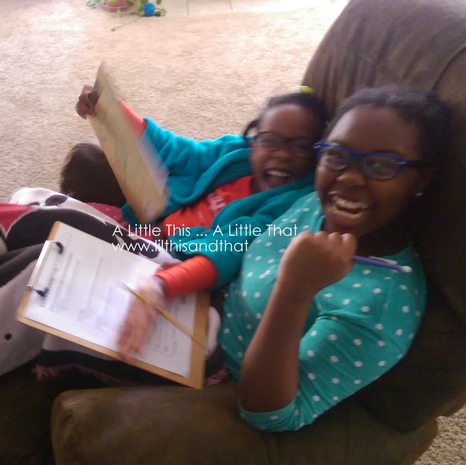The girls are ready to watch the Visual Learning Systems weather video. The picture is blurry, but I love their smiles. :)