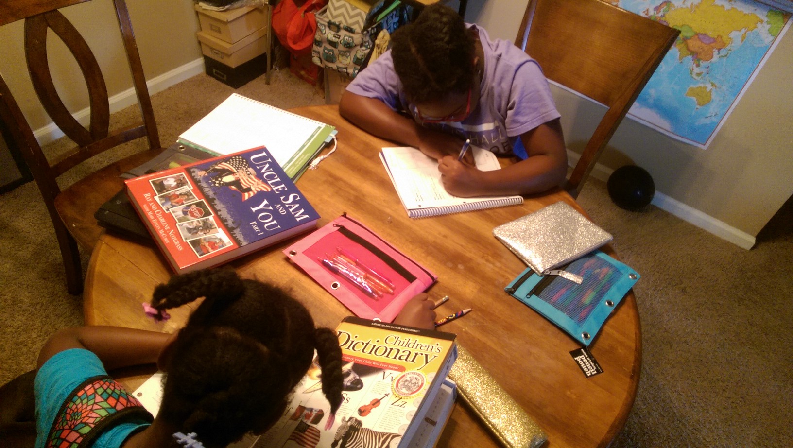 The girls working on vocabulary with Notgrass Uncle Sam and You