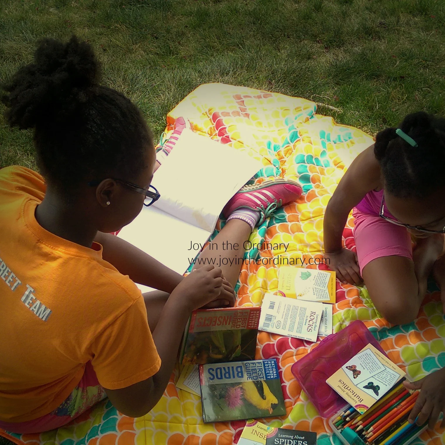 Girls studying nature outdoors. 