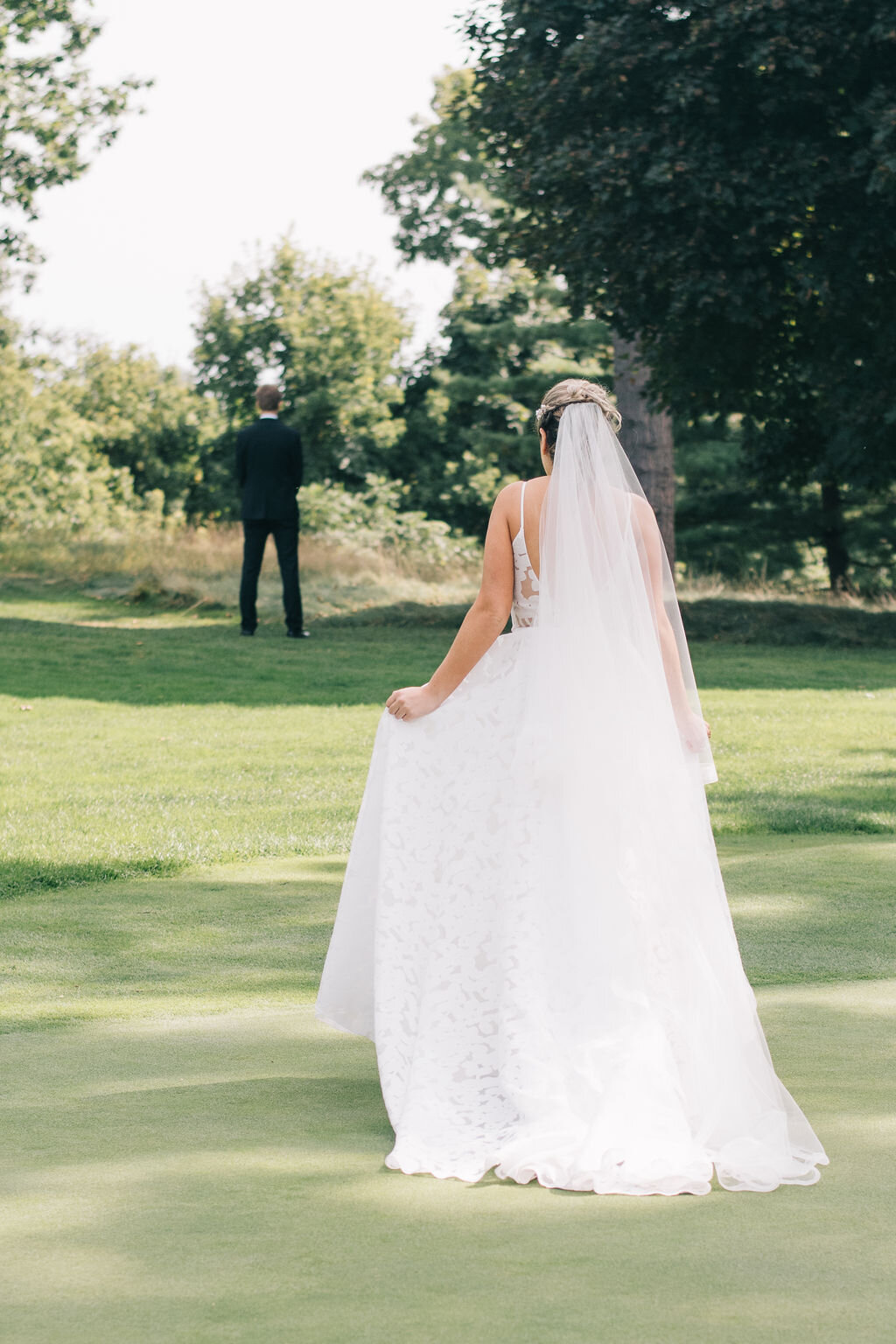 Bride and Groom's emotional first look on their Toronto Golf Club wedding day photographed by Toronto Wedding Photographers, Ugo Photography