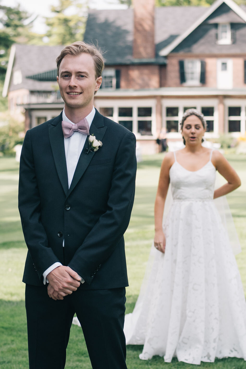 Couple's timeless first look on their Toronto Golf Club wedding day photographed by Toronto wedding photographers, Ugo Photography