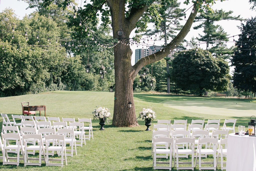 Elegant outdoor ceremony for couple's summer wedding at the Toronto Golf Club photographed by Toronto Wedding Photographers, Ugo Photography