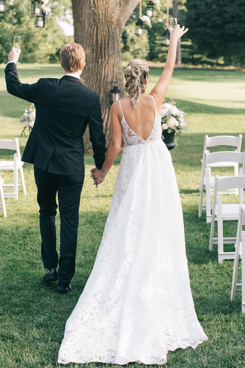 Bride and groom's joyous summer wedding day at the Toronto Golf Club photographed by Toronto Wedding Photographers, Ugo Photography