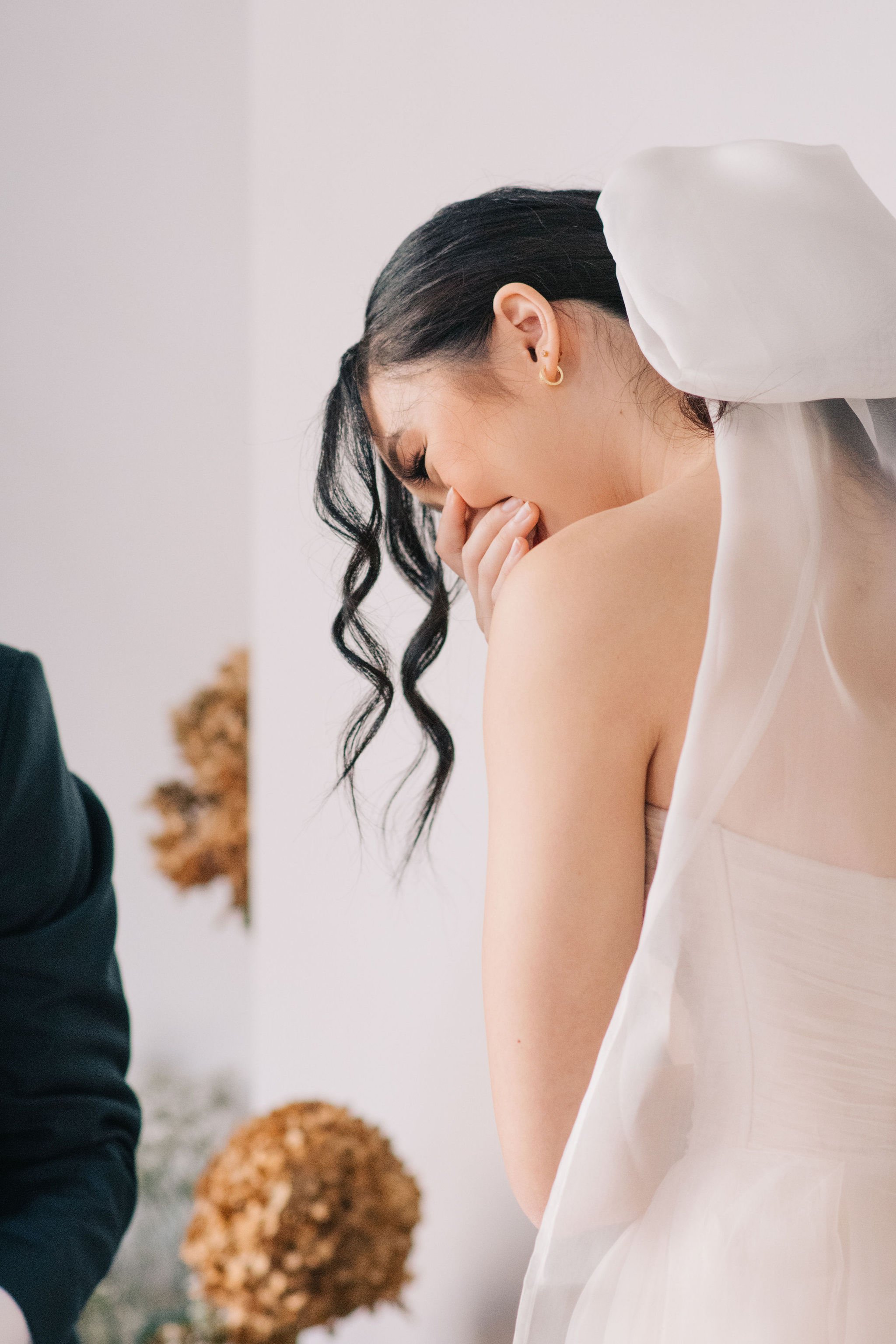 Happy and heartfelt moments during couple's intimate wedding ceremony in downtown Toronto photographed by Toronto wedding photographers, Ugo Photography