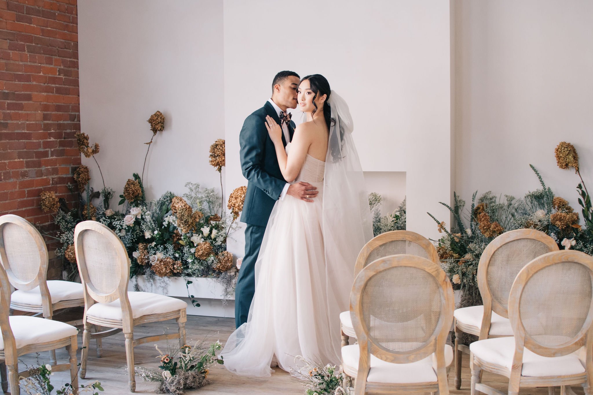 Timeless kiss during couple's intimate wedding ceremony in downtown Toronto photographed by Toronto wedding photographers, Ugo Photography
