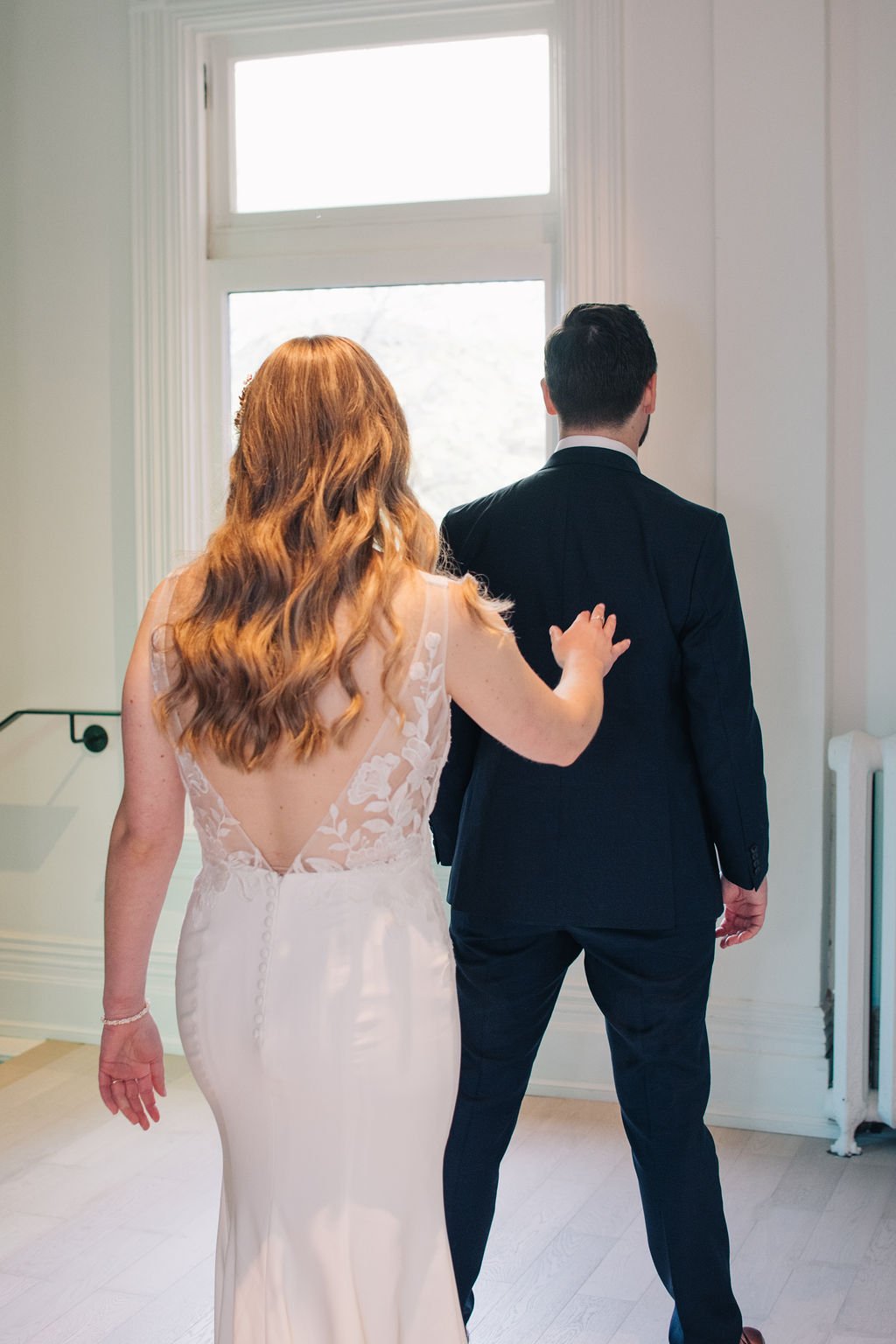 Bride and groom have their wedding day first look at Toronto's Gladstone House Hotel, photographed by Toronto wedding photographers, Ugo Photography