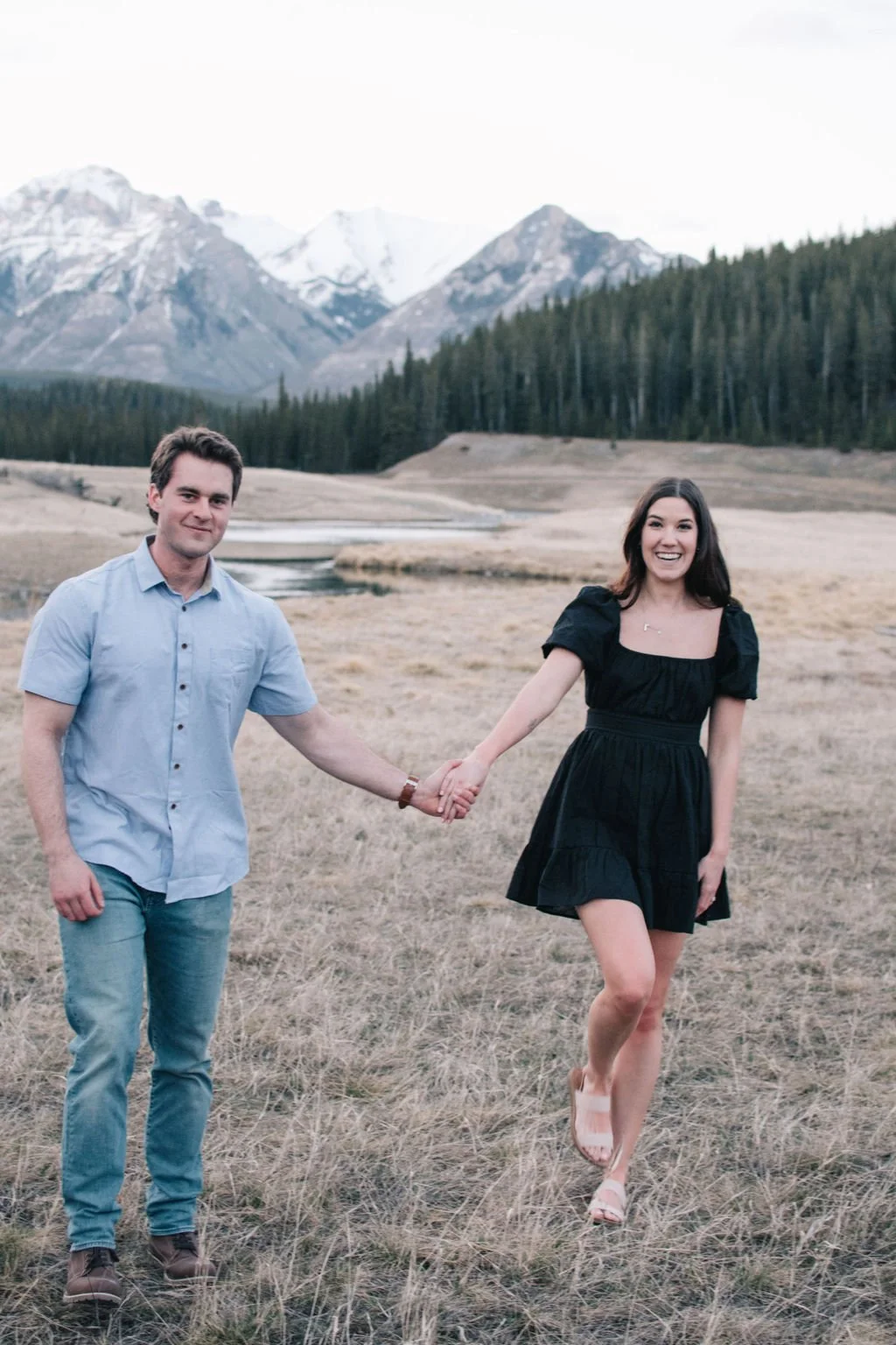 Joyous destination engagement session in Banff National Park photographed by Niagara wedding photographers, Ugo Photography