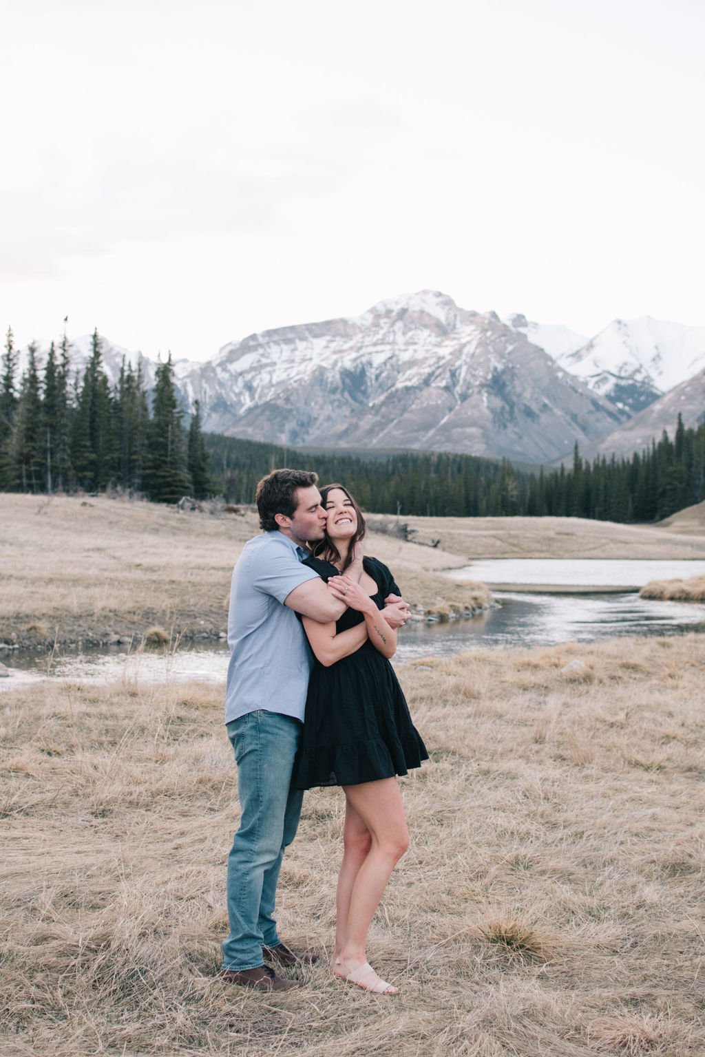 Joyous destination engagement session in Banff National park photographed by Niagara wedding photographers, Ugo Photography