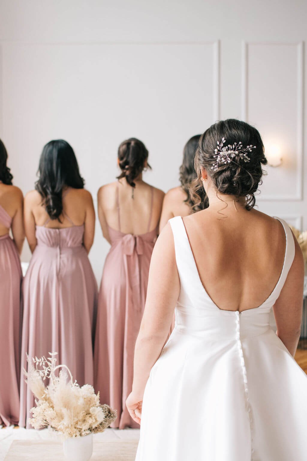 Toronto bride and her bridesmaids share first look photographed by Toronto wedding photographers, Ugo Photography