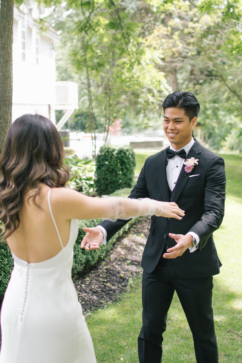 Bride and groom's joyful first look on their wedding day at the Doctor's House