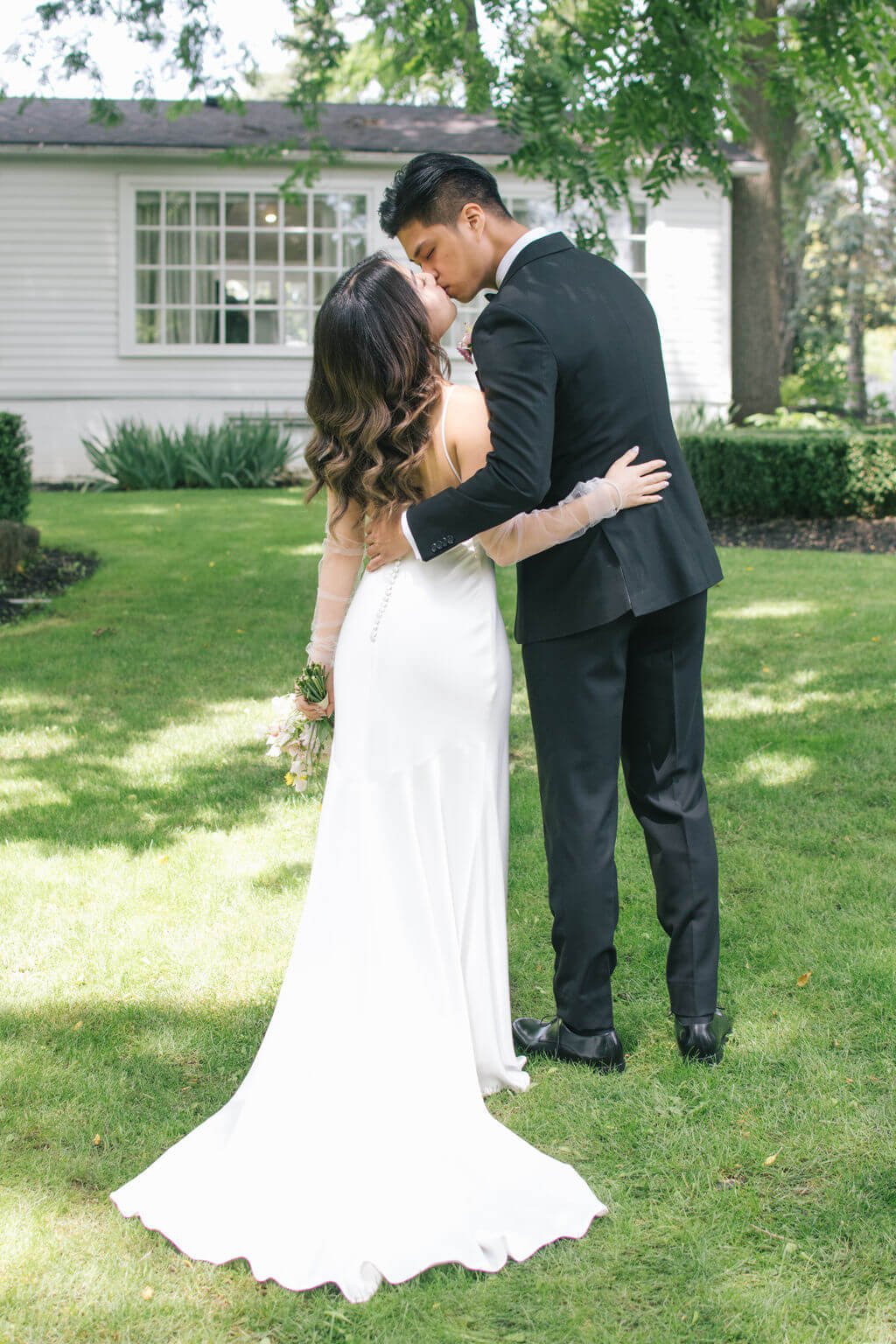 First kiss for bride and groom on their wedding day at The Doctor's House