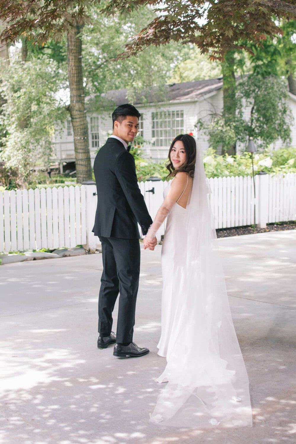 Modern romance for bride and groom's chic summer wedding at the Doctor's House