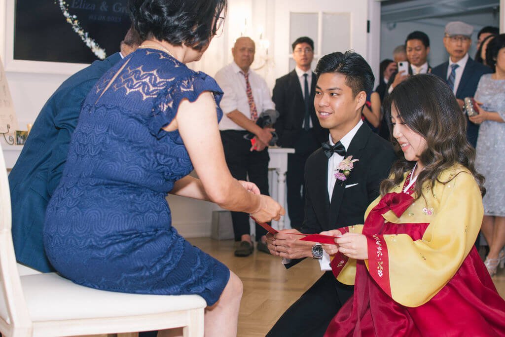 Traditional tea ceremony during bride and groom's summer wedding at The Doctor's House