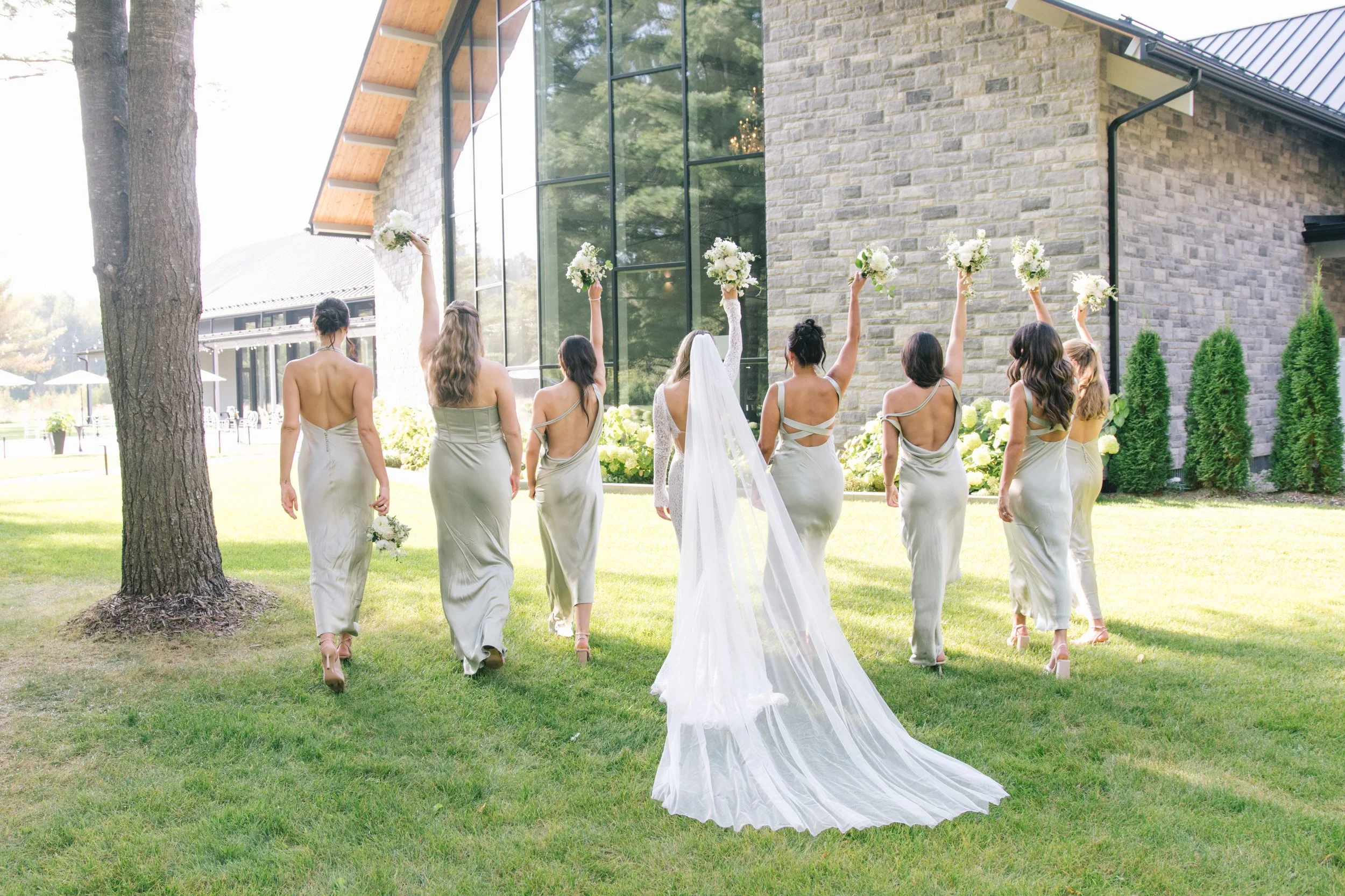 bride-and-bridesmaids-walking-away-cottage-country-wedding-barrie