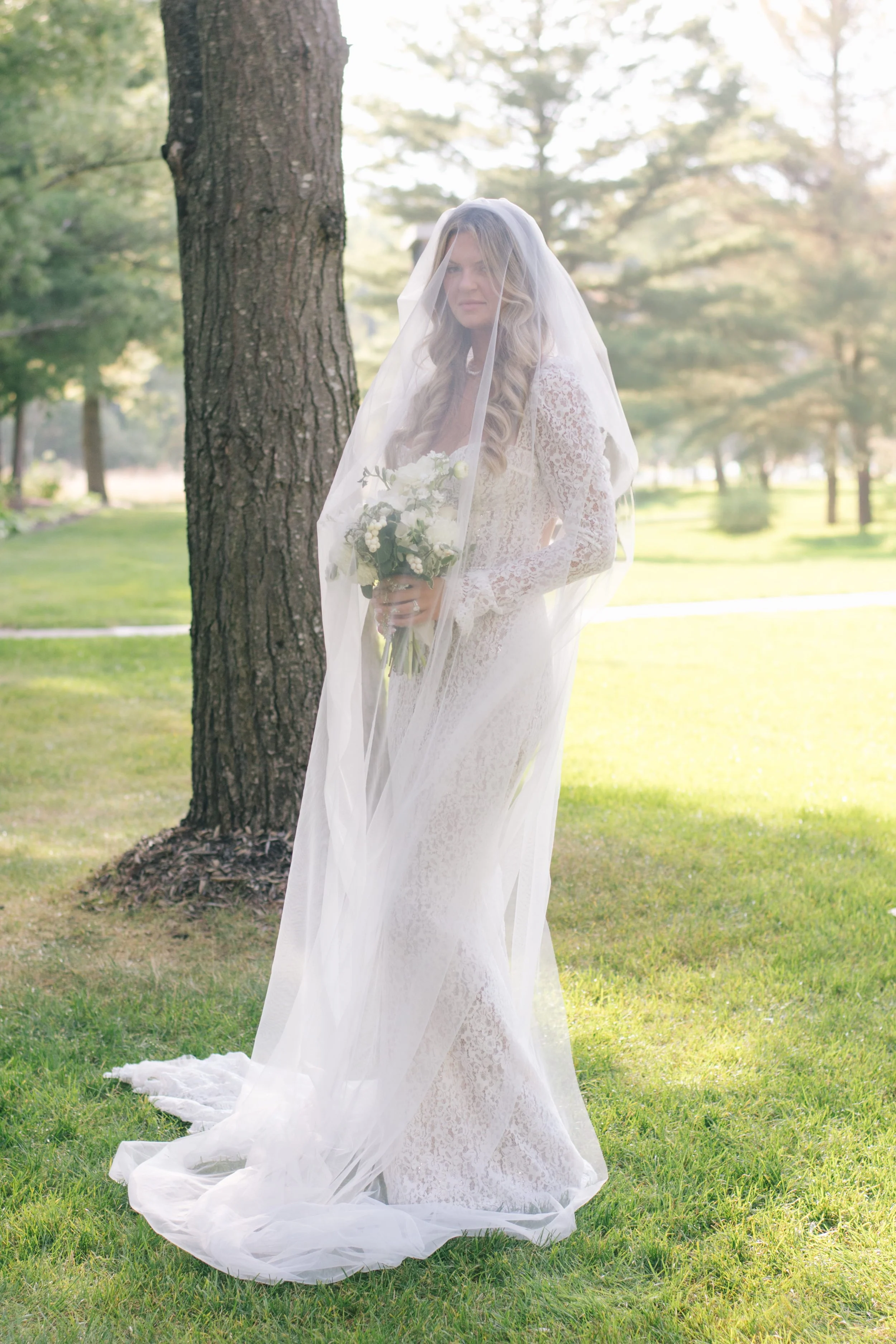 editorial-bridal-portrait-lace-gown-three-feathers-terrace