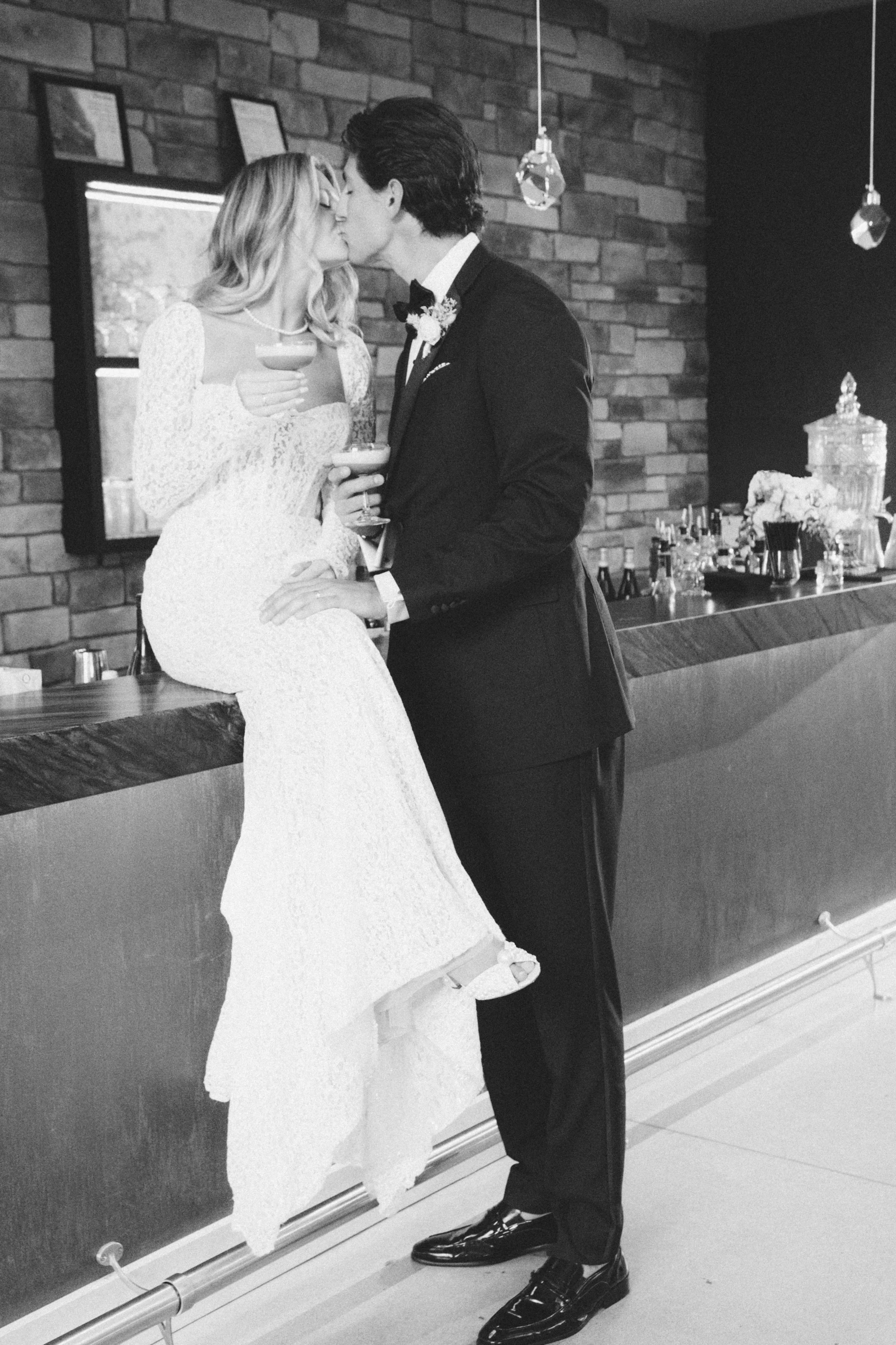 editorial-black-and-white-bride-groom-bar-portrait