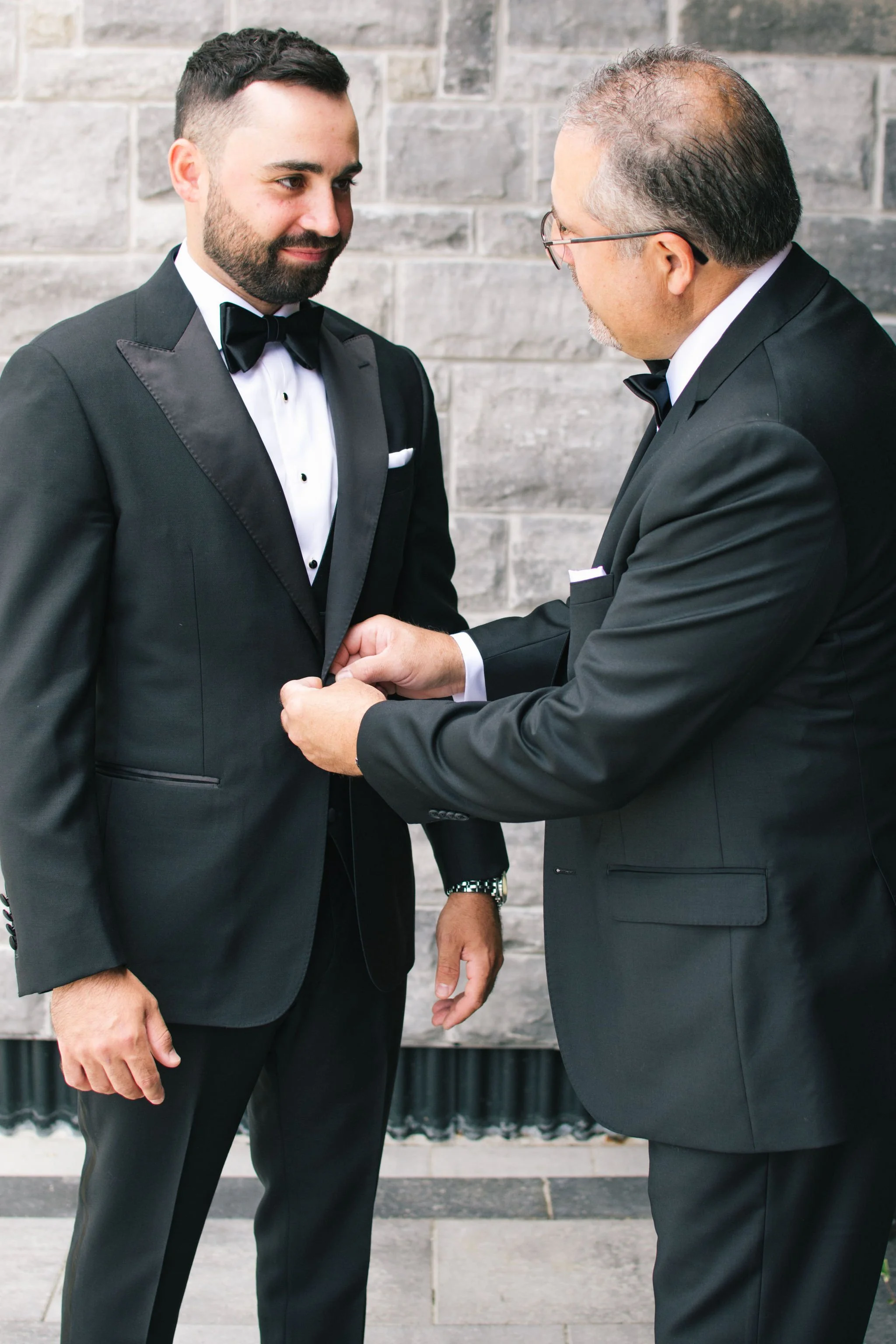 groom-getting-ready-black-tie-tuxedo-three-feathers-terrace