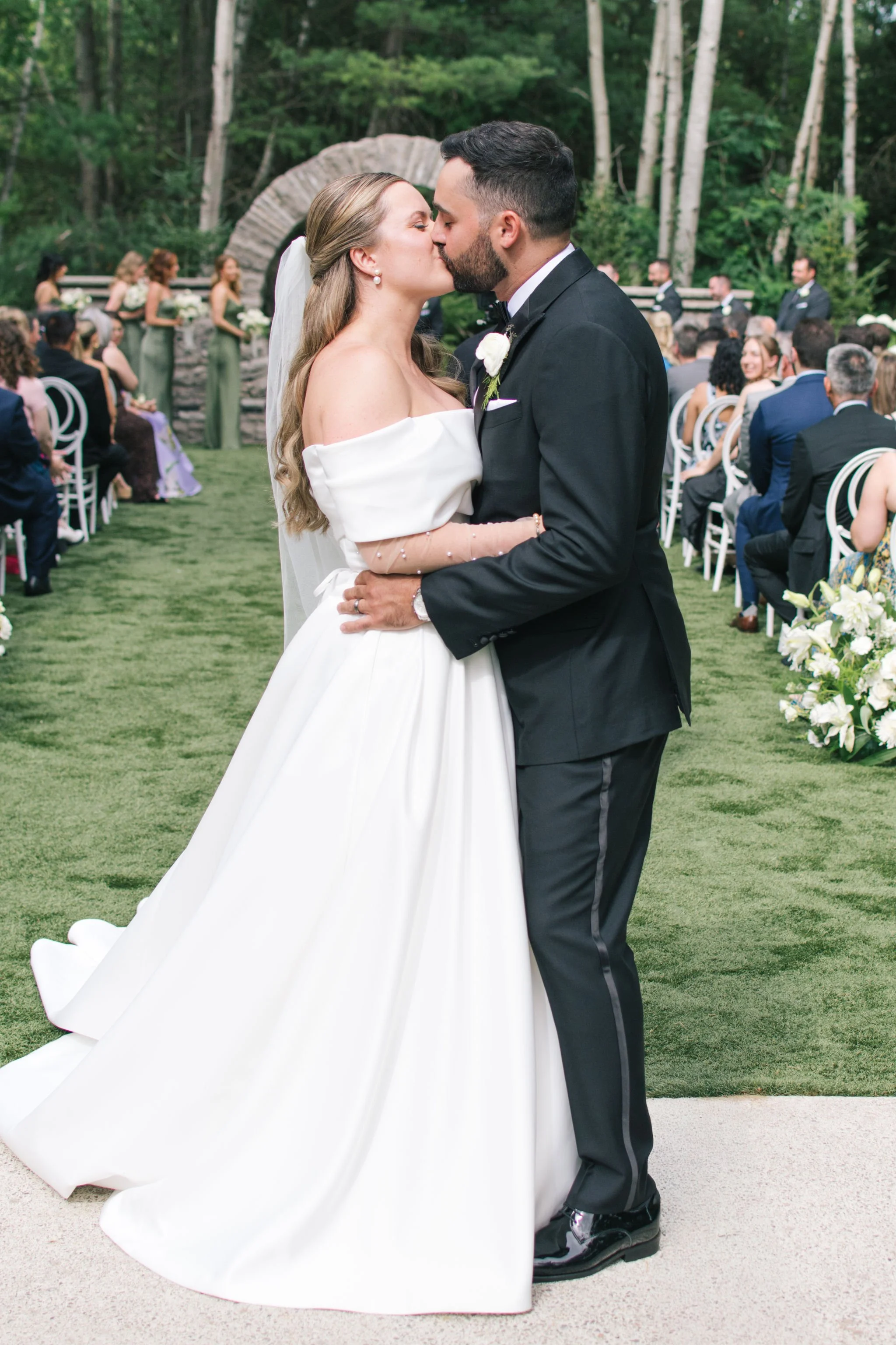 three-feathers-terrace-wedding-recessional-first-kiss