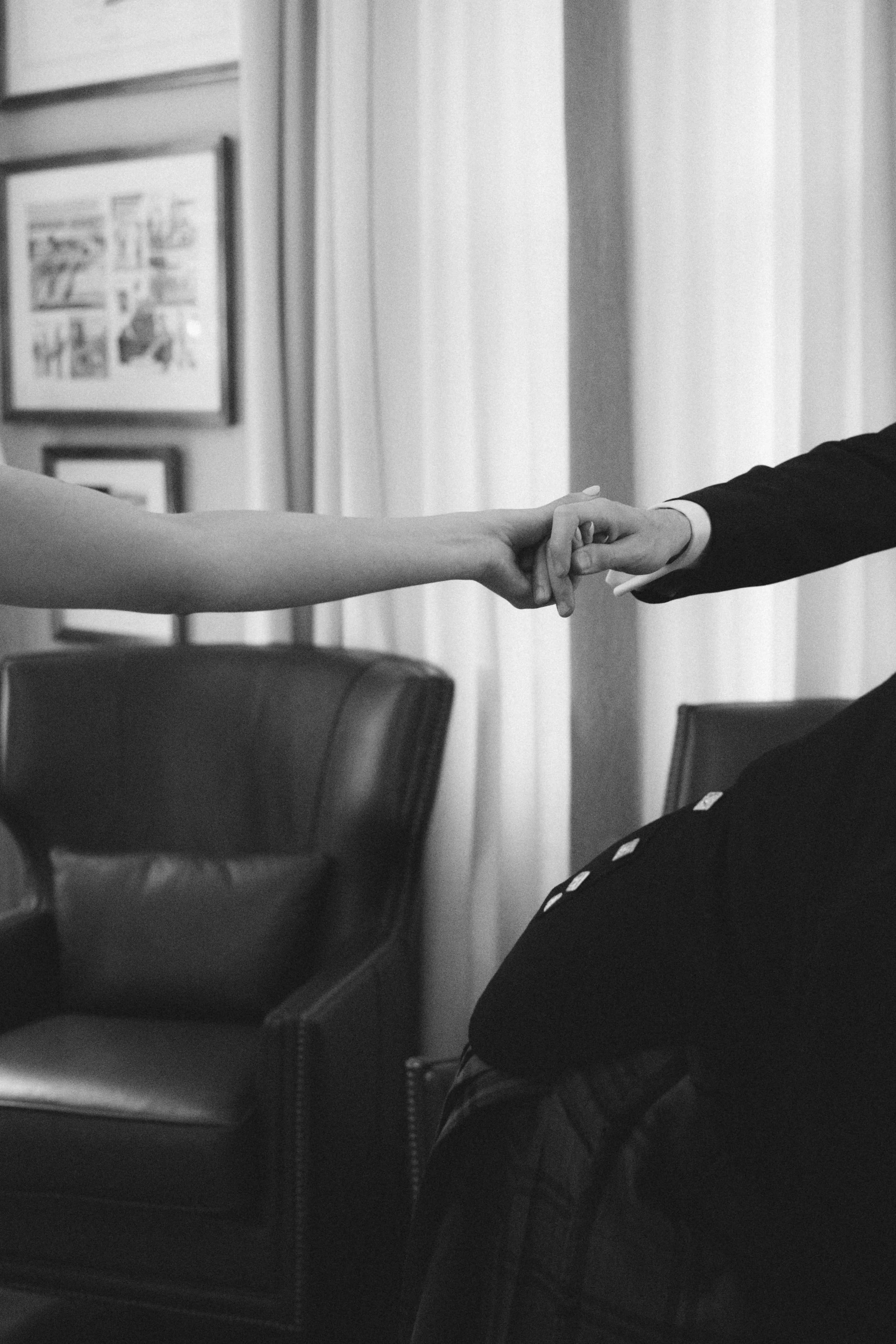 Bride and groom holding hands during an intimate moment on their wedding day
