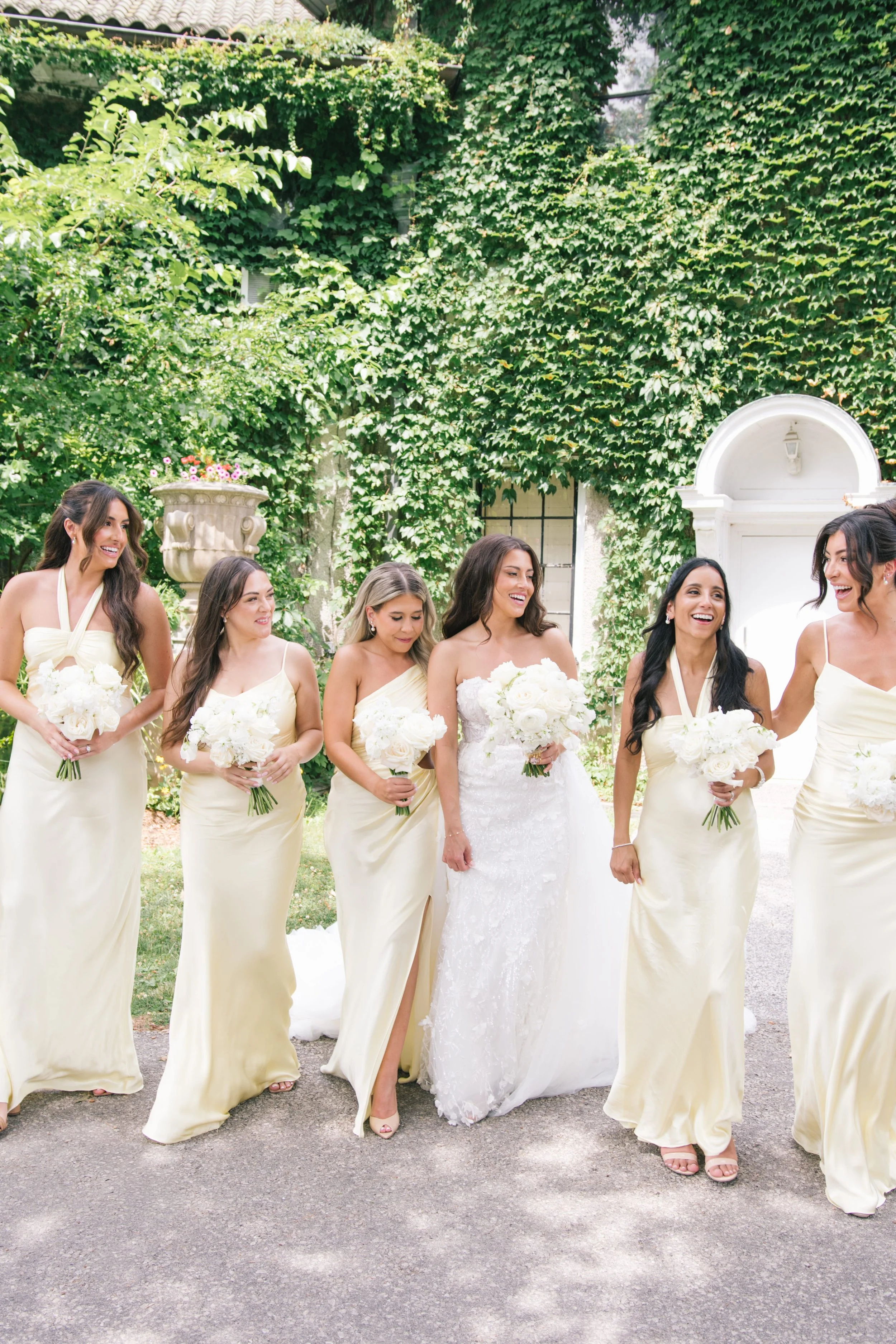Bride walking with her bridesmaids outdoors during a wedding celebration