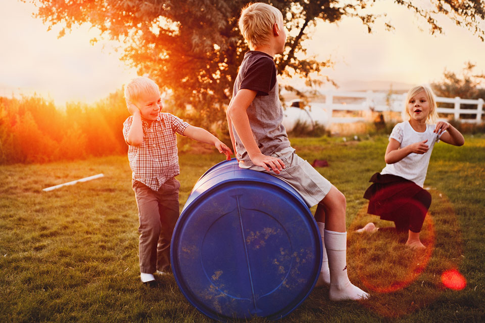 kids-playing-outside-barrel.jpg