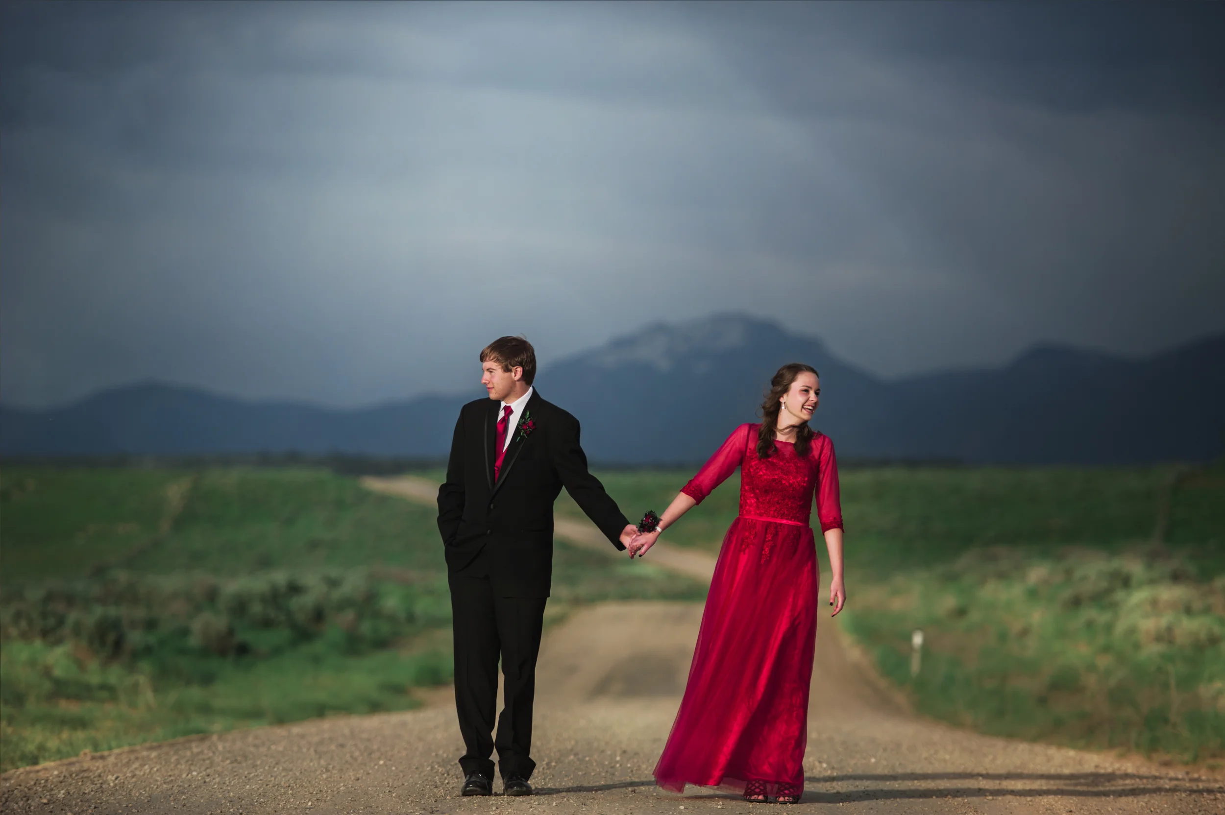 couple on road holding hands
