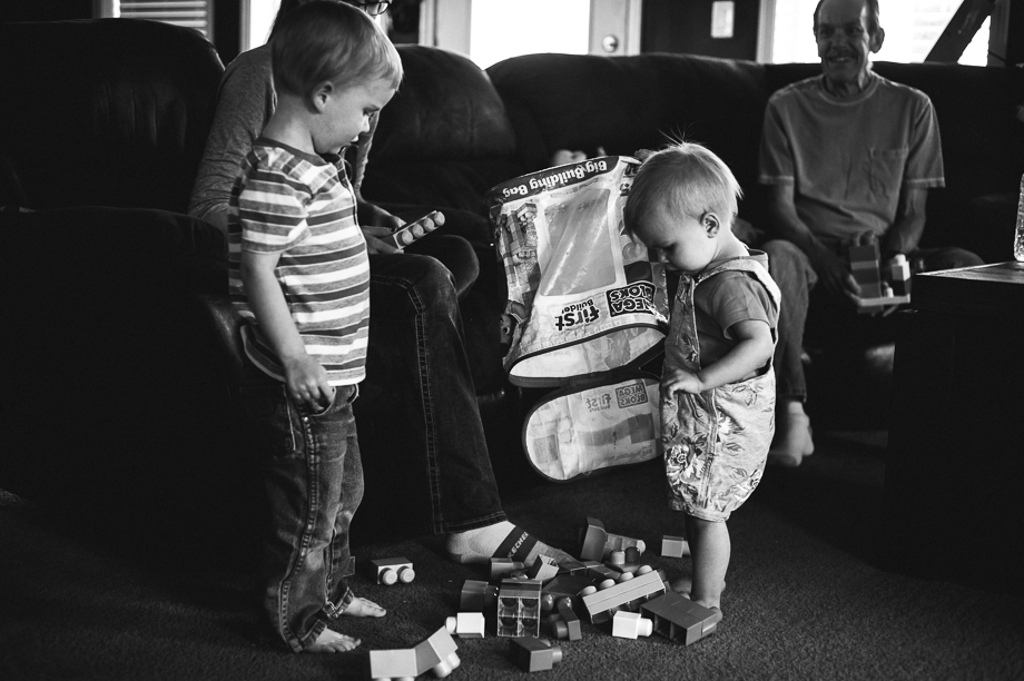kids dumping out duplo toys