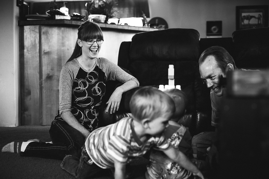 mom laughing while kids play