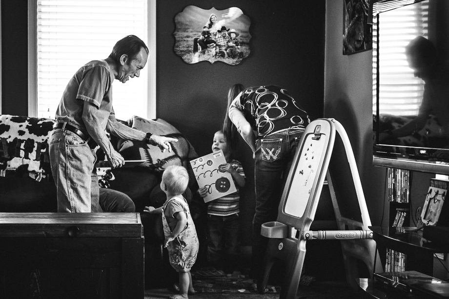 grandpa getting books from grandkids