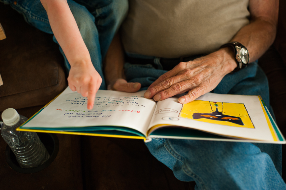 hands pointing to book