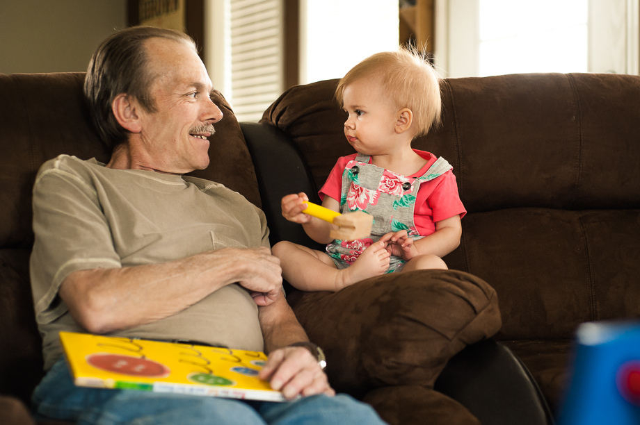 man and toddler sharing a smile