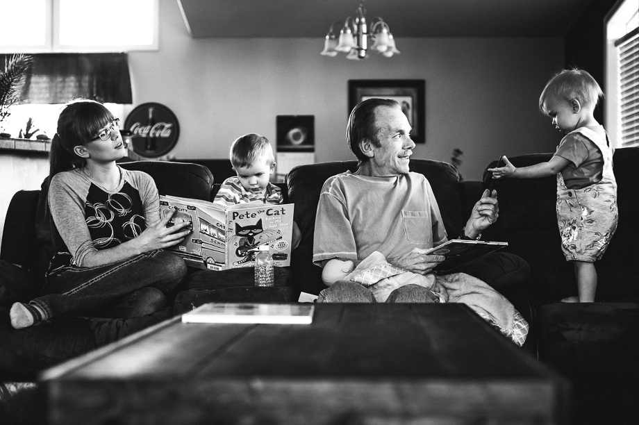 family on couch with books